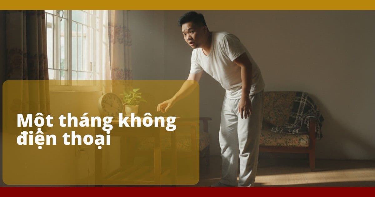 Người đàn ông Việt đứng trong phòng sáng sớm, với tay tới chỗ đặt điện thoại mà không tìm thấy, không khí nhẹ nhàng và yên lặng.